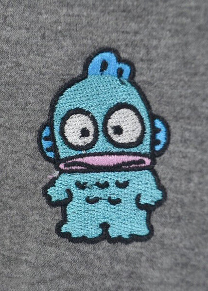 Sanrio Hangyodon Sherpa Zip Up Hoodie in charcoal with Hangyodon embroidery on sherpa-lined zip-up rave festival jacket — pocket detail view