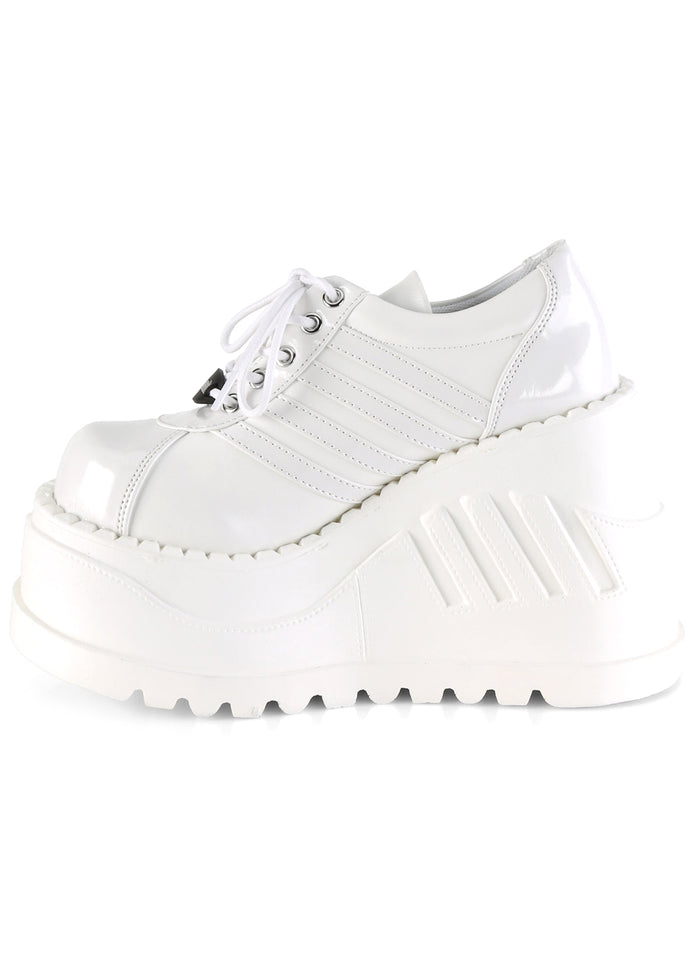 Demonia STOMP 08 White Rave Platform Sneakers in white matte patent vegan leather showing sporty stripe detail and lace-up front closure — detail shot