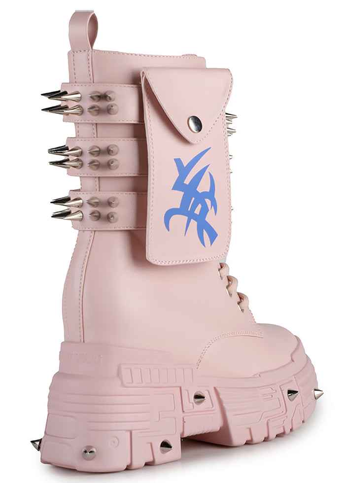 Close-up studio view of Anthony Wang X WTF CV Chem Baby Metal Pink platform boot detailing the functional calf pocket, silver hardware rivets, and defensive spikes along the lower armor panel