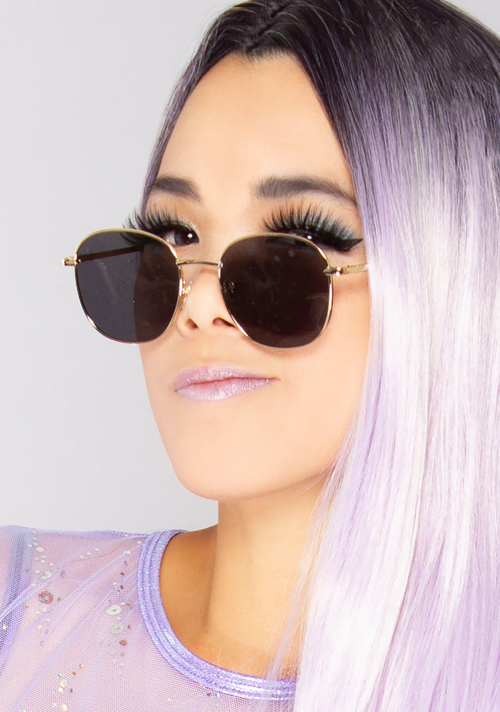 Dime Optics Avalon Sunglasses in matte gold grey — model view