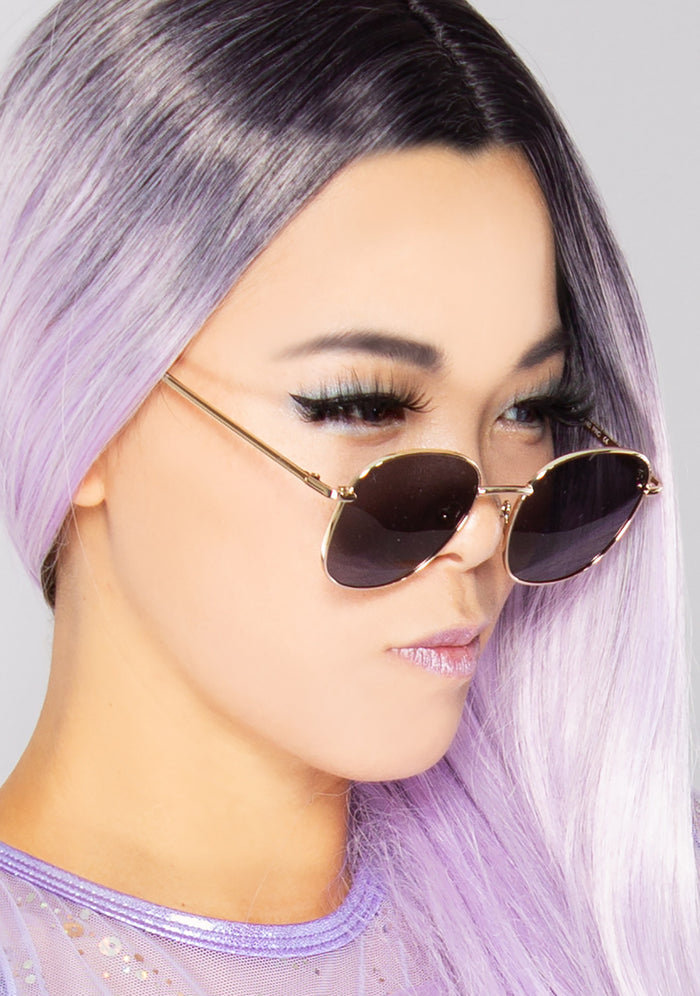 Dime Optics Avalon Sunglasses in matte gold grey — model side view