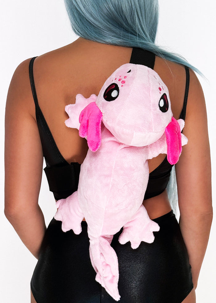 Sleepyville Critters Axolotl Plush Sling Backpack in pink with 3D axolotl plush on kawaii rave festival sling backpack — model side view