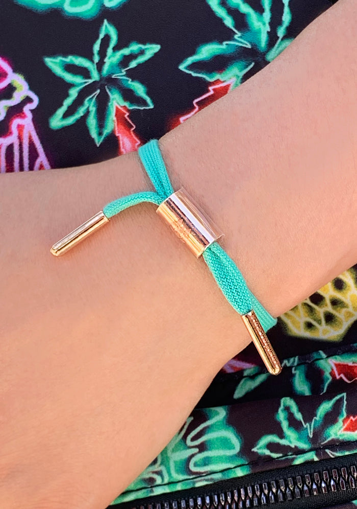 Rastaclat Brandy Women's Single Lace Bracelet in turquoise rose gold — model view