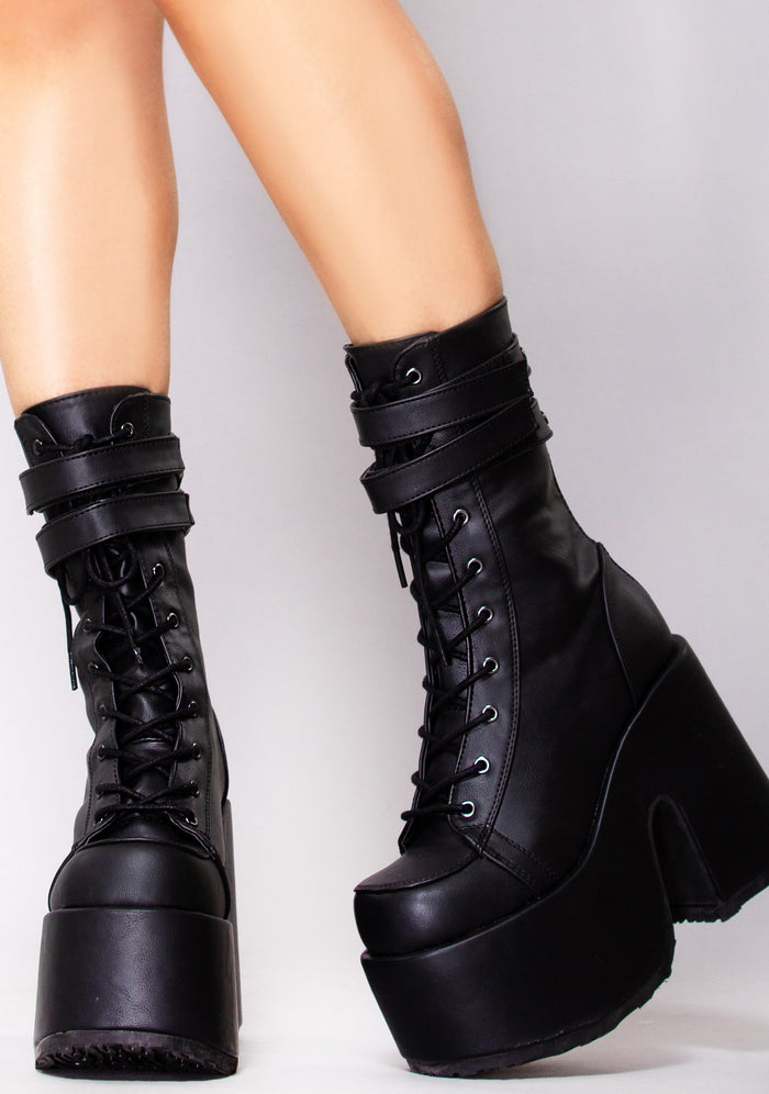 Demonia CAMEL 250 Night Dive Black Platform Boots in black vegan leather with 3 inch chunky platform and traction sole worn by model — front view