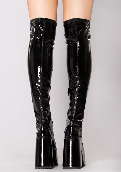 Demonia CAMEL 300 Mistress May I Patent Black Platform Boots in black patent leather thigh-high worn by model — back view