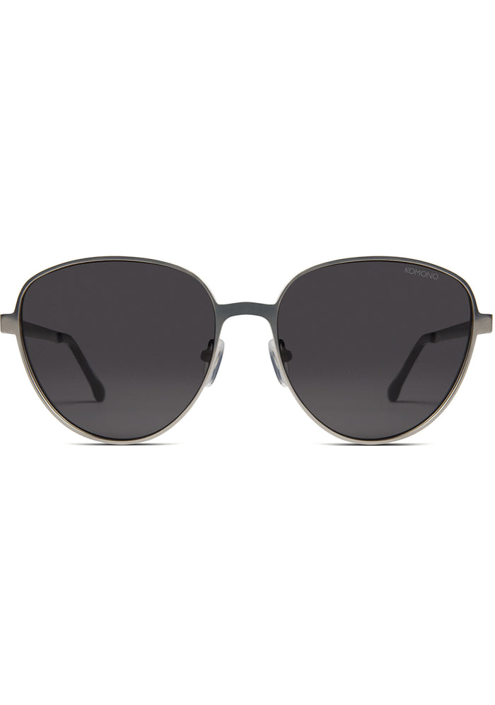 Komono Chris Sunglasses in matte black with oversized metal frame and translucent blue lens on festival sunglasses — front view