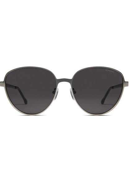 Komono Chris Sunglasses in matte black with oversized metal frame and translucent blue lens on festival sunglasses — front view