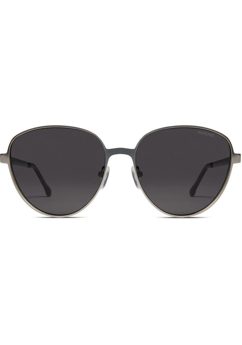 Komono Chris Sunglasses in matte black with oversized metal frame and translucent blue lens on festival sunglasses — front view