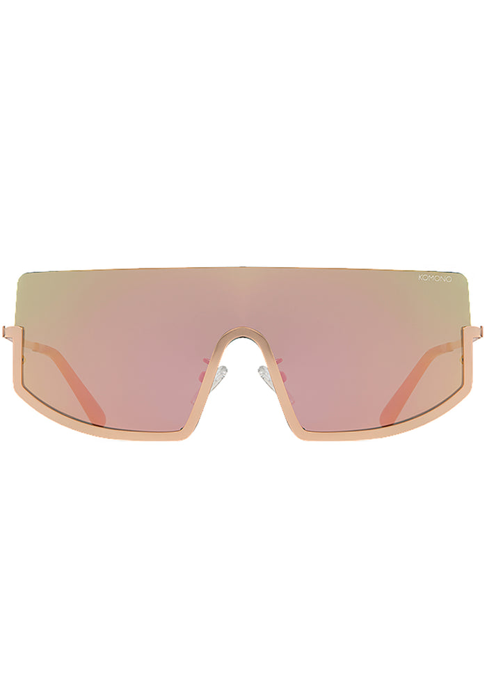 Komono CRAFTED Sonny Heat Sunglasses in pink with oversized curved frame and rose gold metal trim and pink gradient lens on festival sunglasses — front view