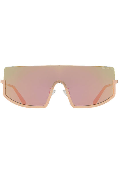 Komono CRAFTED Sonny Heat Sunglasses in pink with oversized curved frame and rose gold metal trim and pink gradient lens on festival sunglasses — front view