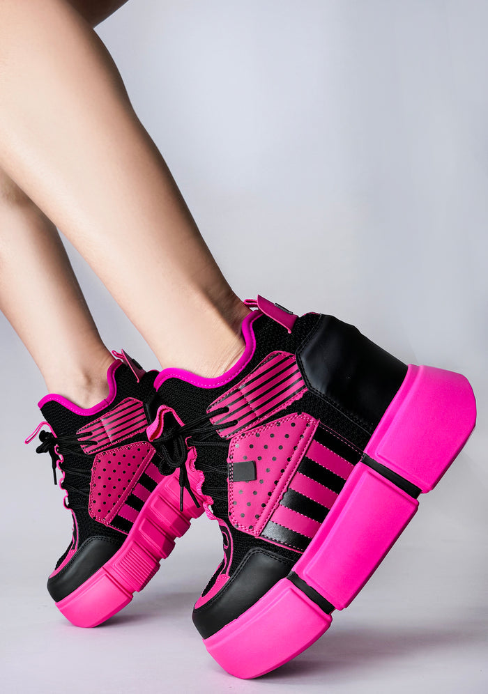 On-foot styling view of Anthony Wang CRANBERRY 08 Pink Circuit platform sneakers showcasing the vibrant pink structural hardware plates, patterned laces, and high-top ankle fit