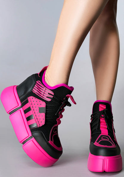 Dynamic on-foot shot of Anthony Wang CRANBERRY 08 Pink Circuit sneakers highlighting the thick neon pink block textures on the 4-inch platform outsole and technical mesh panels