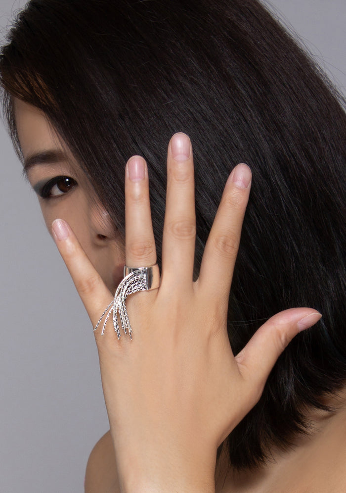 8 Other Reasons Cyber Storm Fringe Ring in silver with polished metal base and fringe embellishment on festival punk ring — model view