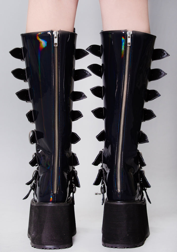 Demonia DAMNED 318 Delusional Dream Hologram Black Platform Boots in iridescent holographic vegan leather with back zip closure worn by model — back view