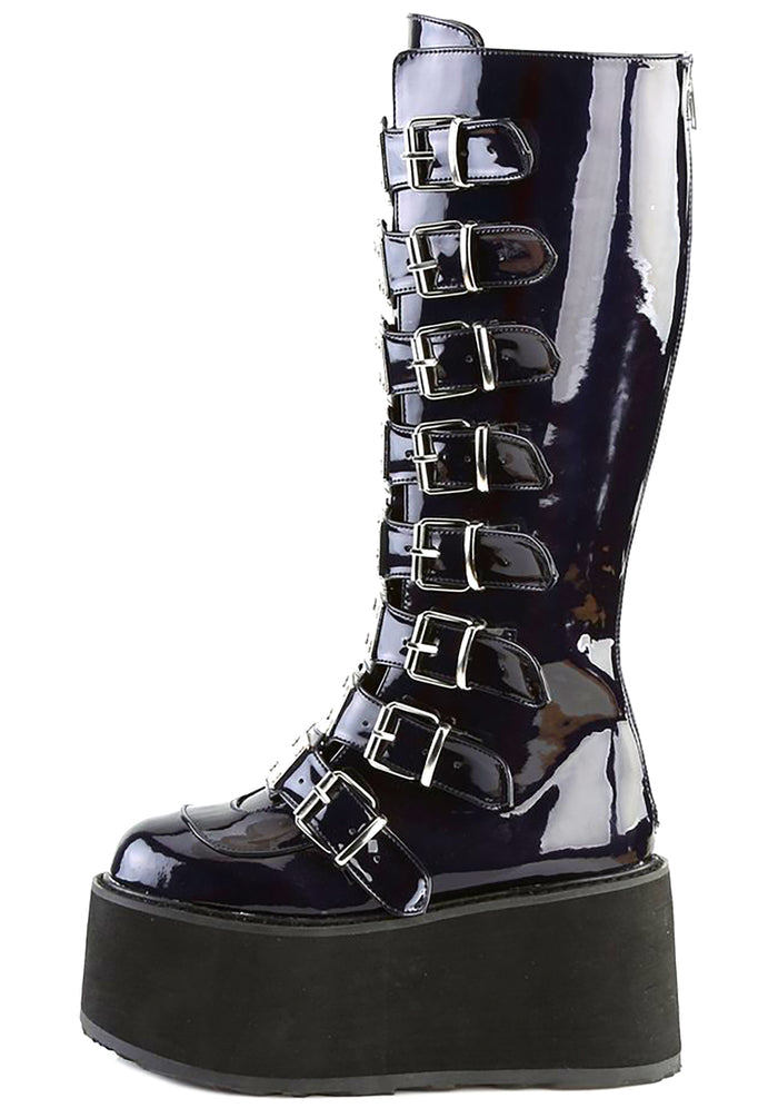 Demonia DAMNED 318 Delusional Dream Hologram Black Platform Boots in iridescent holographic vegan leather showing knee-high silhouette and silver plate buckle detail — side view