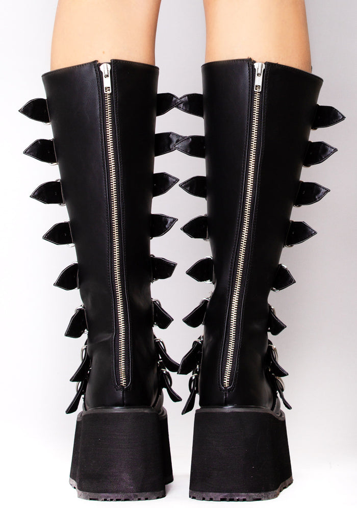 Demonia DAMNED 318 Obsession Black Platform Boots in black vegan leather with back zip closure worn by model — back view