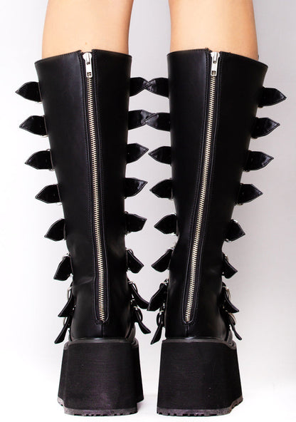 Demonia DAMNED 318 Obsession Black Platform Boots in black vegan leather with back zip closure worn by model — back view