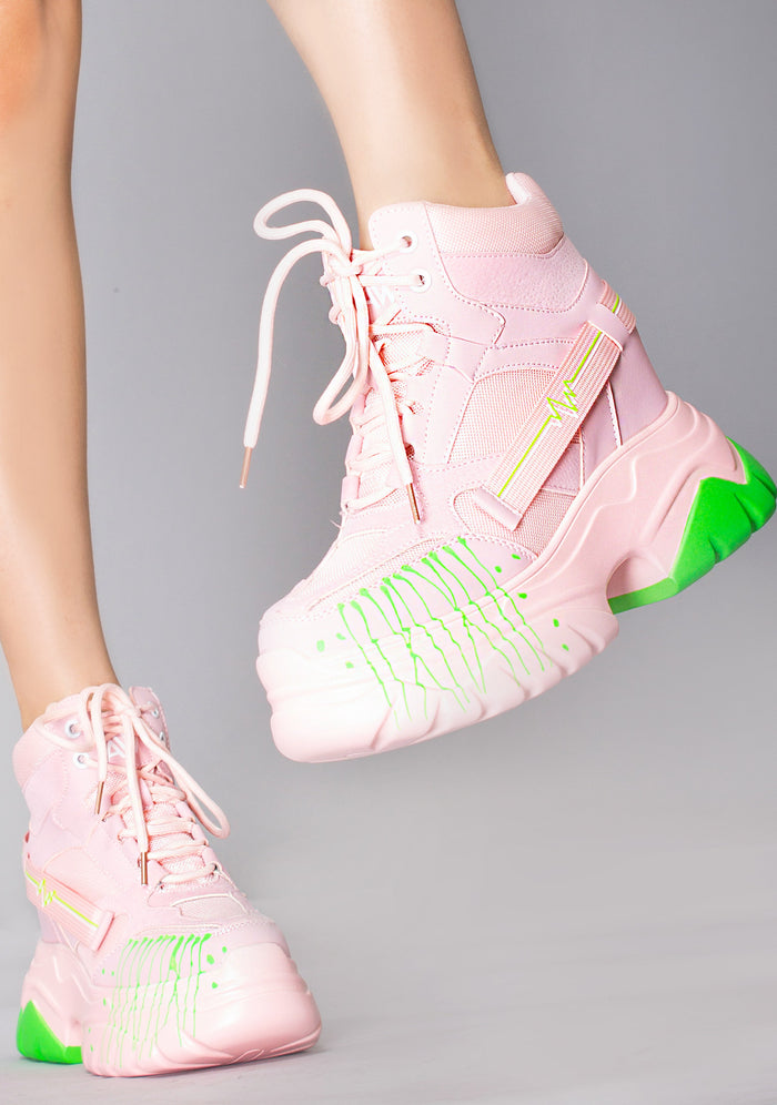 Anthony Wang DATE 01 Techno Heartbeat Platform Sneakers in pastel pink with neon green paint splatter outsole worn by model — front view