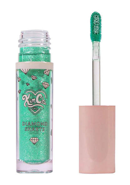 Kimchi Chic DIAMOND SHARTS Liquid Glitter Illuminator in 10 Standing Ovation mint with star glitter in twist cap bottle on rave makeup illuminator — swatch view
