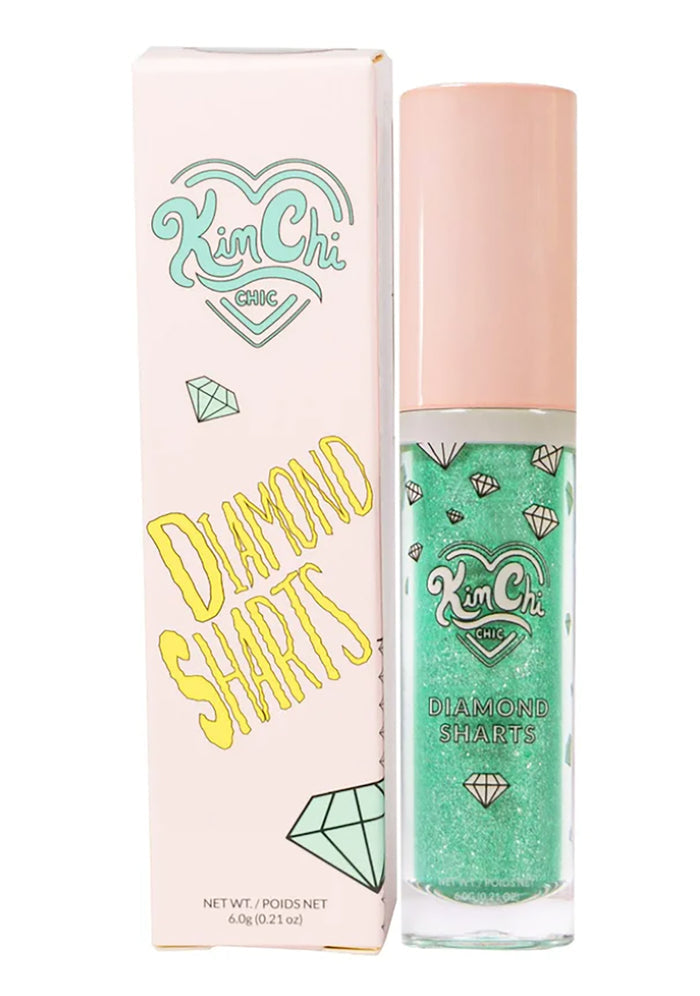 Kimchi Chic DIAMOND SHARTS Liquid Glitter Illuminator in 10 Standing Ovation mint with star glitter in twist cap bottle on rave makeup illuminator — model applied view