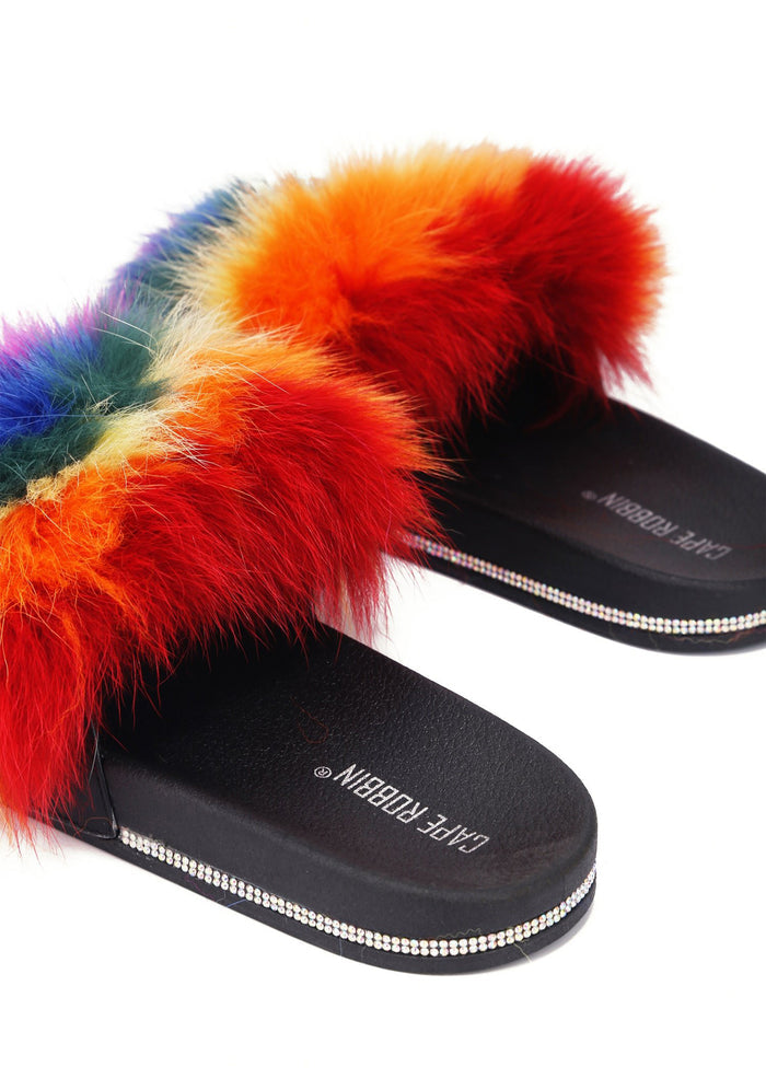 Close-up studio view of the Cape Robbin Fever Dream sandal, emphasizing the texture of the plush multicolored faux fur and the precision of the rhinestone border.