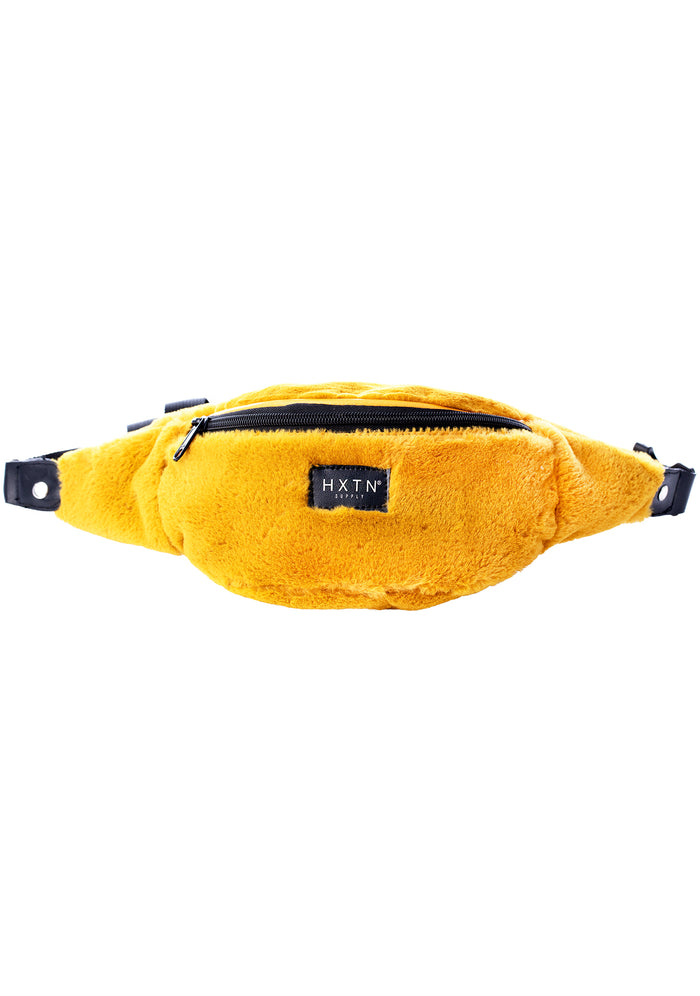 HXTN Supply Furocious One Belt Bag in mustard yellow with faux fur outer and branded label on festival rave belt bag — front view