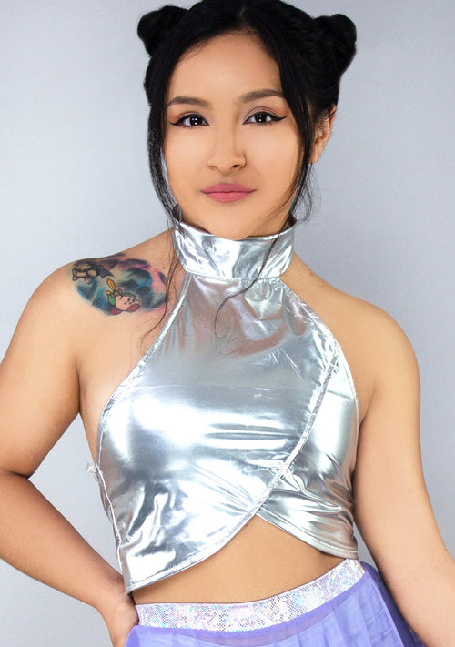 Hot & Delicious Galactica Metallic Halter Top in silver with button and loop halter closure on rave top — model view