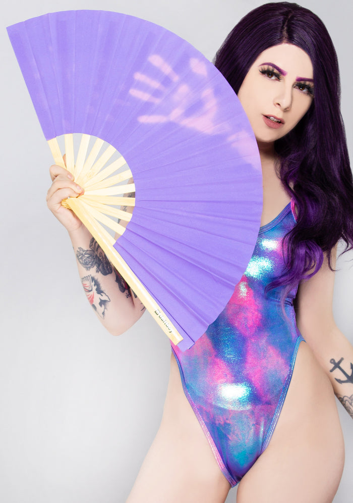 Daftboy Game Changer Color Change Rave Fan in purple pink with heat reactive fabric on eco-friendly bamboo festival fan — model view