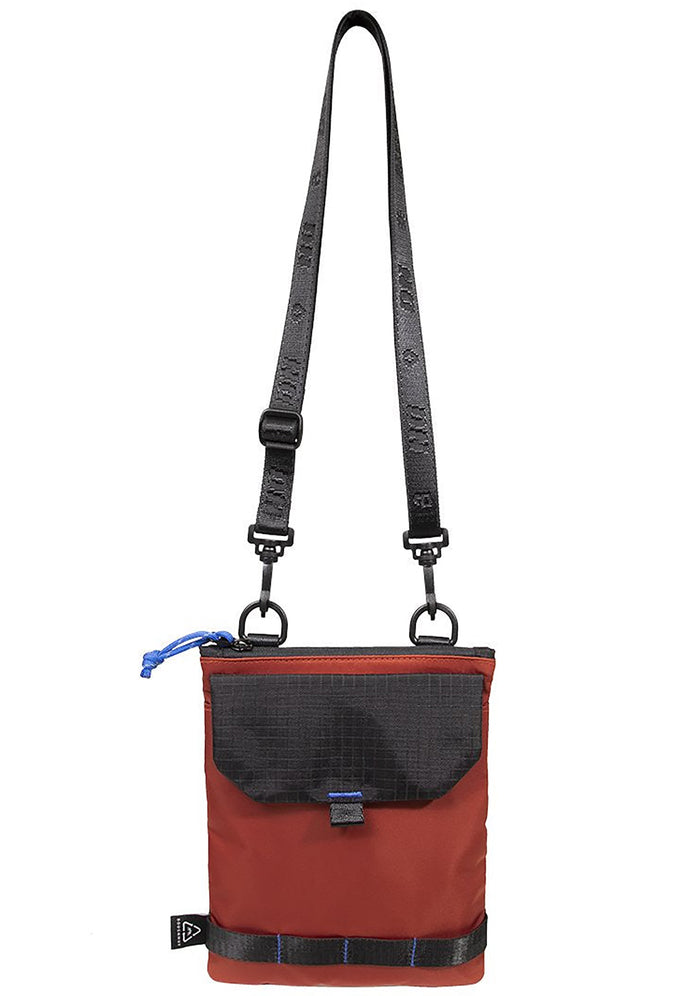 Doughnut Official Gamescape Series Teleport Crossbody Bag in blood orange with embroidered details and black metal hardware on festival crossbody bag — front view