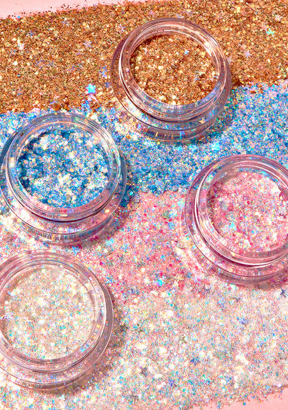 Kimchi Chic GLITTER SHARTS Gel Glitter Pots in 04 Super Star gold with holographic star and hexagon glitter in gel pot on rave makeup body glitter — model cheek view
