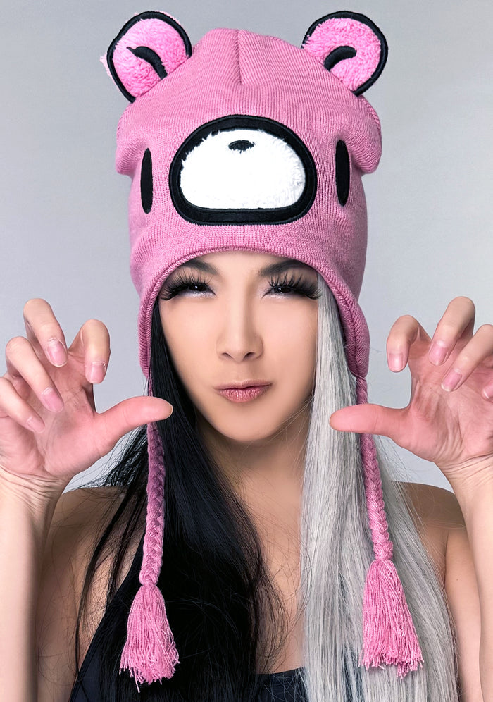 Bioworld Gloomy Bear Laplander Fleece Cosplay Beanie in pink with 3D Gloomy Bear ears and embroidered face detail on kawaii rave festival hat — model view