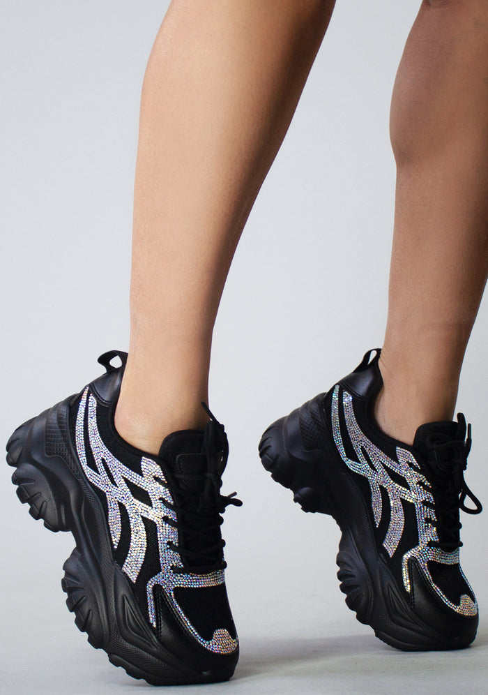 Side view of the Berness HANNA 02 black platform sneakers on-model, showcasing the shimmering rhinestone detailing along the side panels and the chunky sole profile.