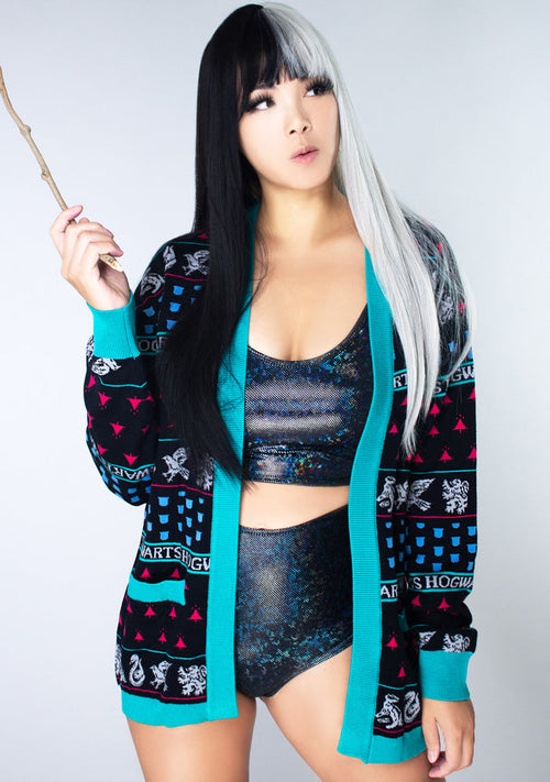 Bioworld Harry Potter Hogwarts House Holiday Cardigan in black multi with jacquard knit house-themed pattern on fandom rave festival jacket — model front view