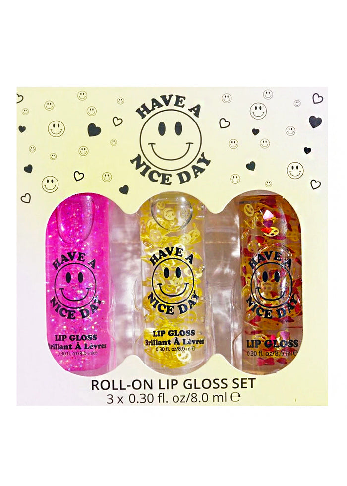 Lavender Stardust Have A Nice Day Lip Gloss Trio Box Set in multicolor with fruity scented roll-on glosses on rave beauty set — front view
