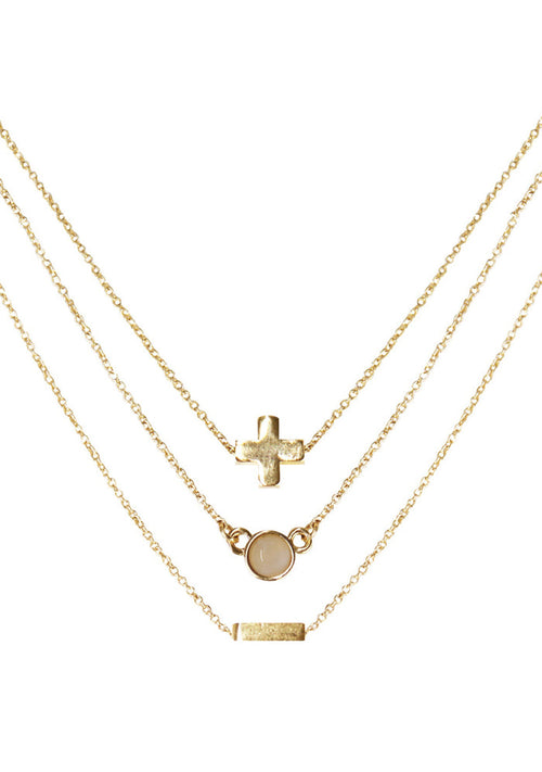 Charged Heart Rose Quartz Delicate Chain Necklace Set in gold with raw rose quartz stone on three 18k gold plated chain crystal festival necklace set — front view