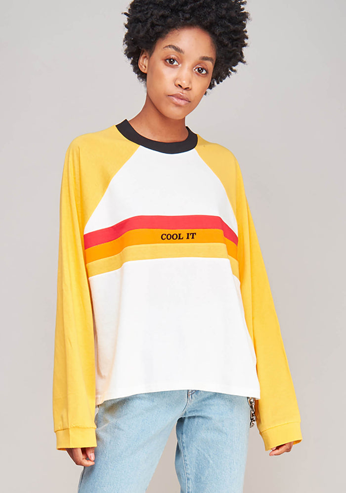 The Ragged Priest Heat Long Sleeve T-Shirt in white yellow with skater stripe and cool it detail on oversized festival top — model view