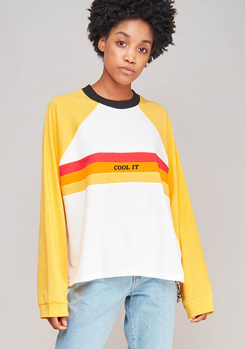 The Ragged Priest Heat Long Sleeve T-Shirt in white yellow with skater stripe and cool it detail on oversized festival top — model view