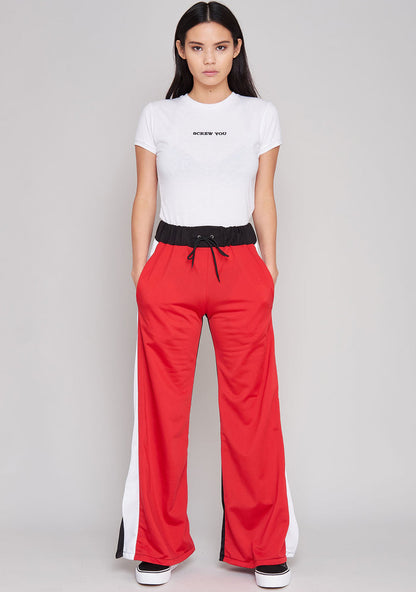 The Ragged Priest Jux Jogger Pants in red multi — model view