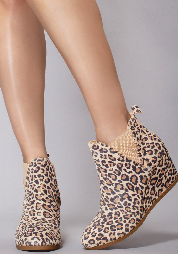 TOMS Kelsey Suede Boot in leopard with all-over leopard print on suede wedge heel festival ankle boot — model front view
