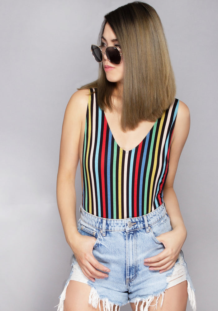 Motel Rocks Lalung P.E. Stripe Bodysuit in black multi with rainbow stripe graphic and thick straps on rave bodysuit — model view