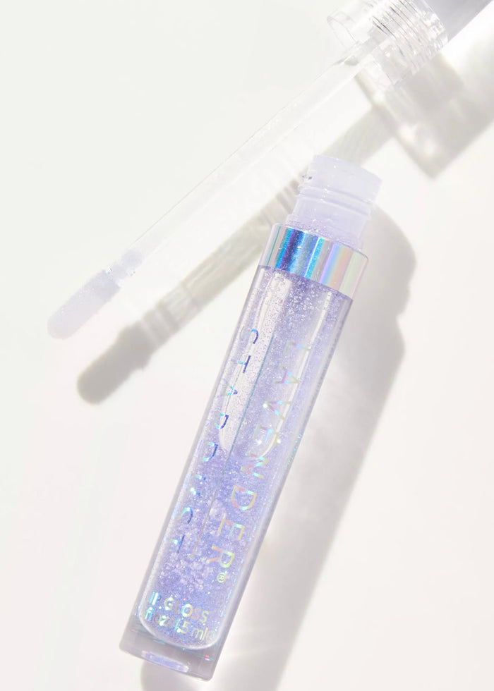Lavender Stardust Lilac Sparkle Cosmic Lip Gloss in light purple — model view
