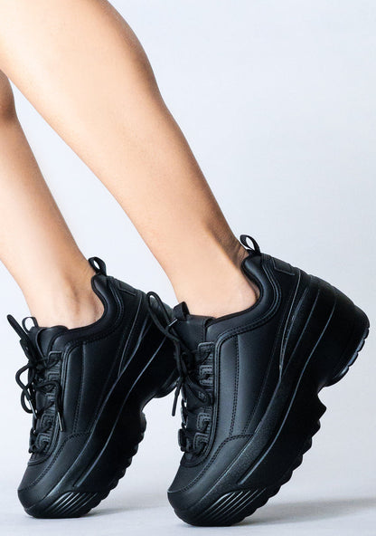 Side view of the Berness LILY 5005 Next Level platform sneakers on-model, highlighting the detailed side stitching and chunky sole profile.