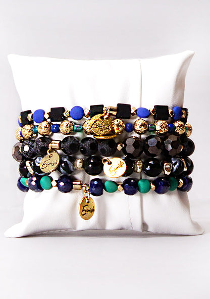 Erimish Midnight Masquerade Bracelet Stack in black green blue-violet with mystical beads on festival bracelet stack — back model view
