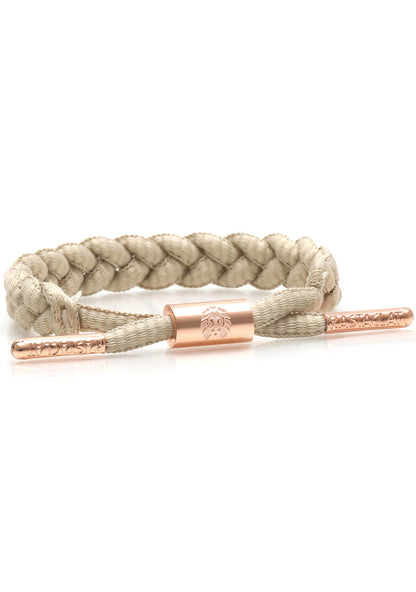 Rastaclat Missy Women's Classic Miniclat Bracelet in nude rose gold with braided shoelace design and rose gold hardware on festival bracelet — front view