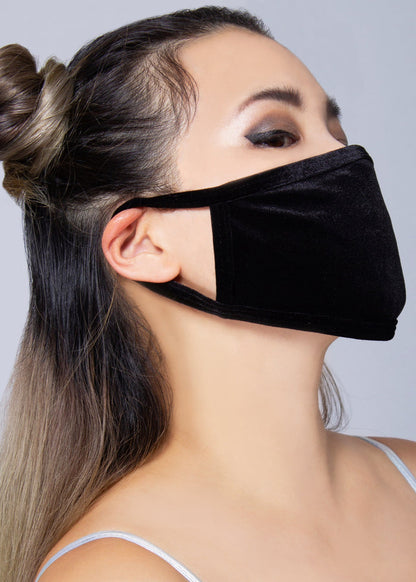 BGlittz Naughty Black Velvet Dust Mask in black with solid black velvet fabric on breathable nylon rave festival face mask — model side view