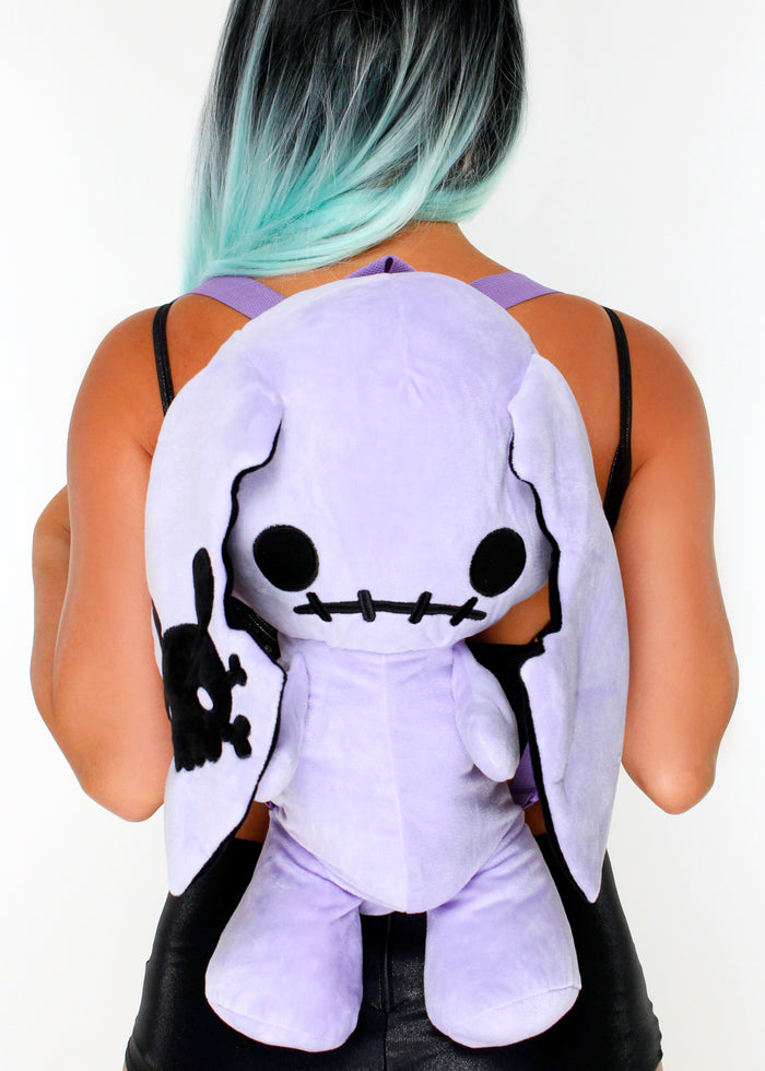 Sleepyville Critters Naughty Bunny Purple Plush Backpack in purple with 3D bunny plush and skull patch ear accent on kawaii goth rave backpack — model front view