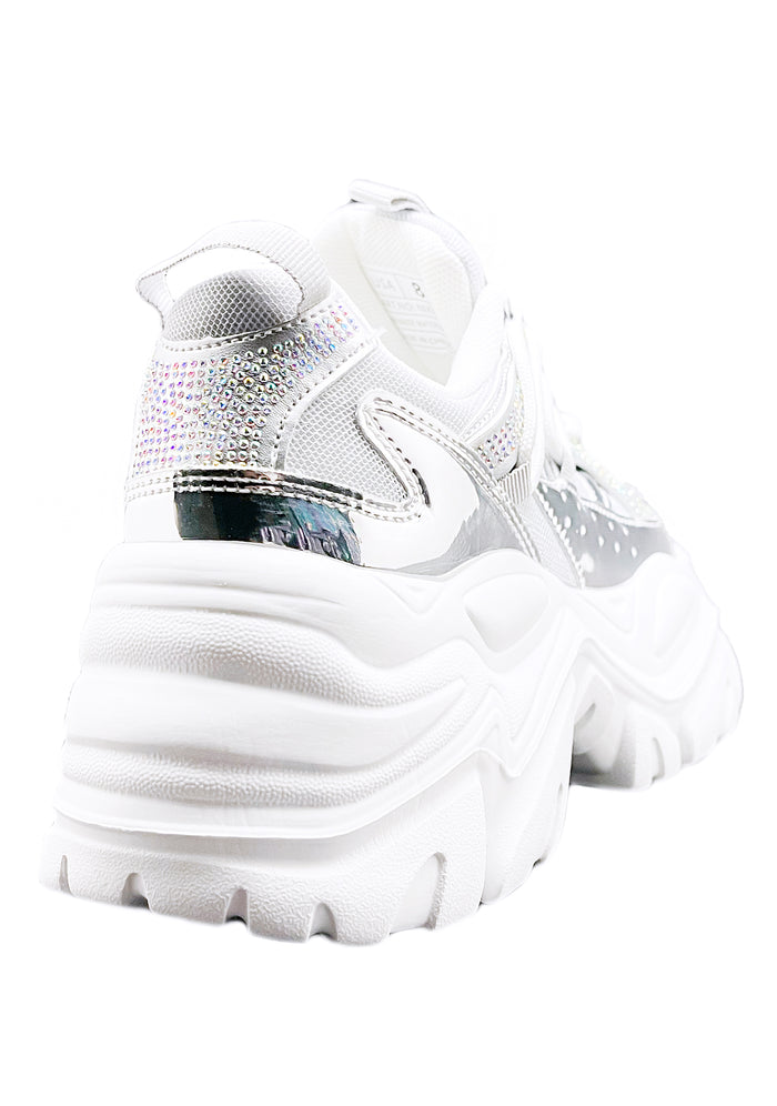 Rear quarter studio view of Berness NIKKI platform sneaker highlighting the stacked white wavy sole and shimmering rhinestone heel accents.