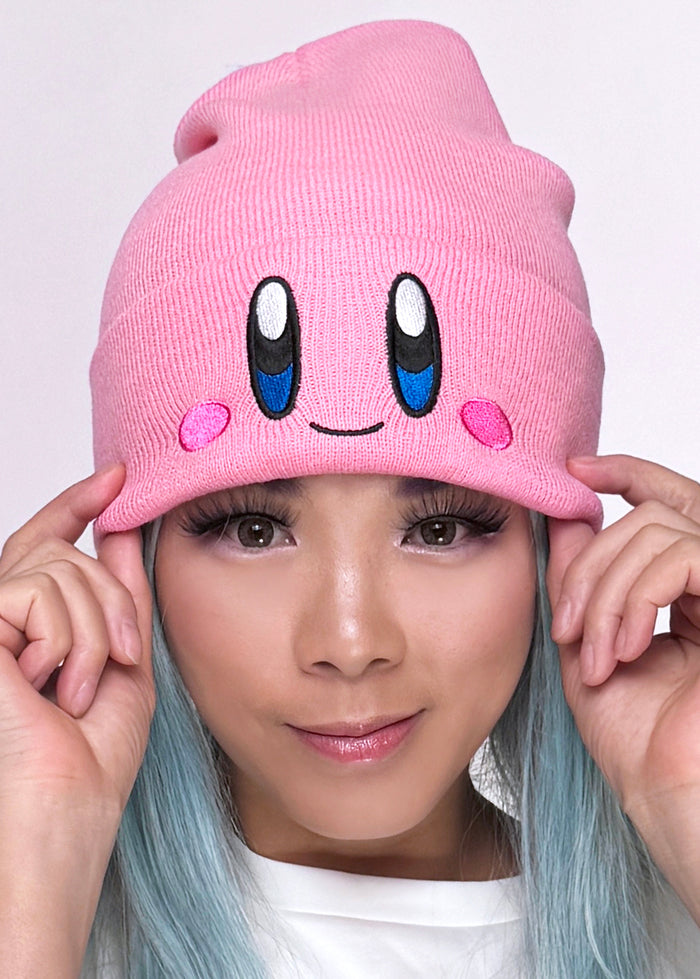 Bioworld Nintendo Kirby Big Face Embroidered Beanie in pink with Kirby embroidered face detail on cuff on kawaii fandom rave festival hat — model view