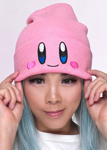 Bioworld Nintendo Kirby Big Face Embroidered Beanie in pink with Kirby embroidered face detail on cuff on kawaii fandom rave festival hat — model view