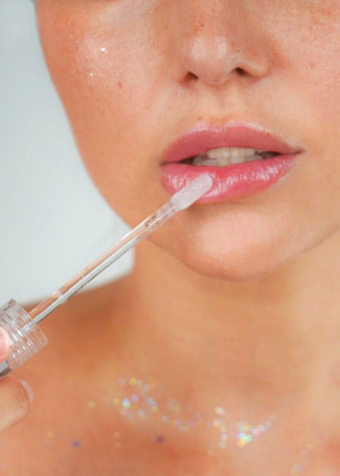 Lavender Stardust Pool Sparkle Cosmic Lip Gloss in light blue — model view 2
